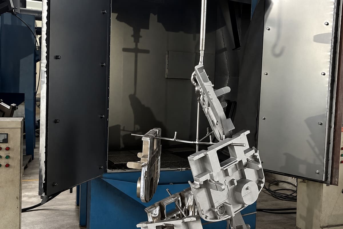 Shot blasting low pressure aluminum castings